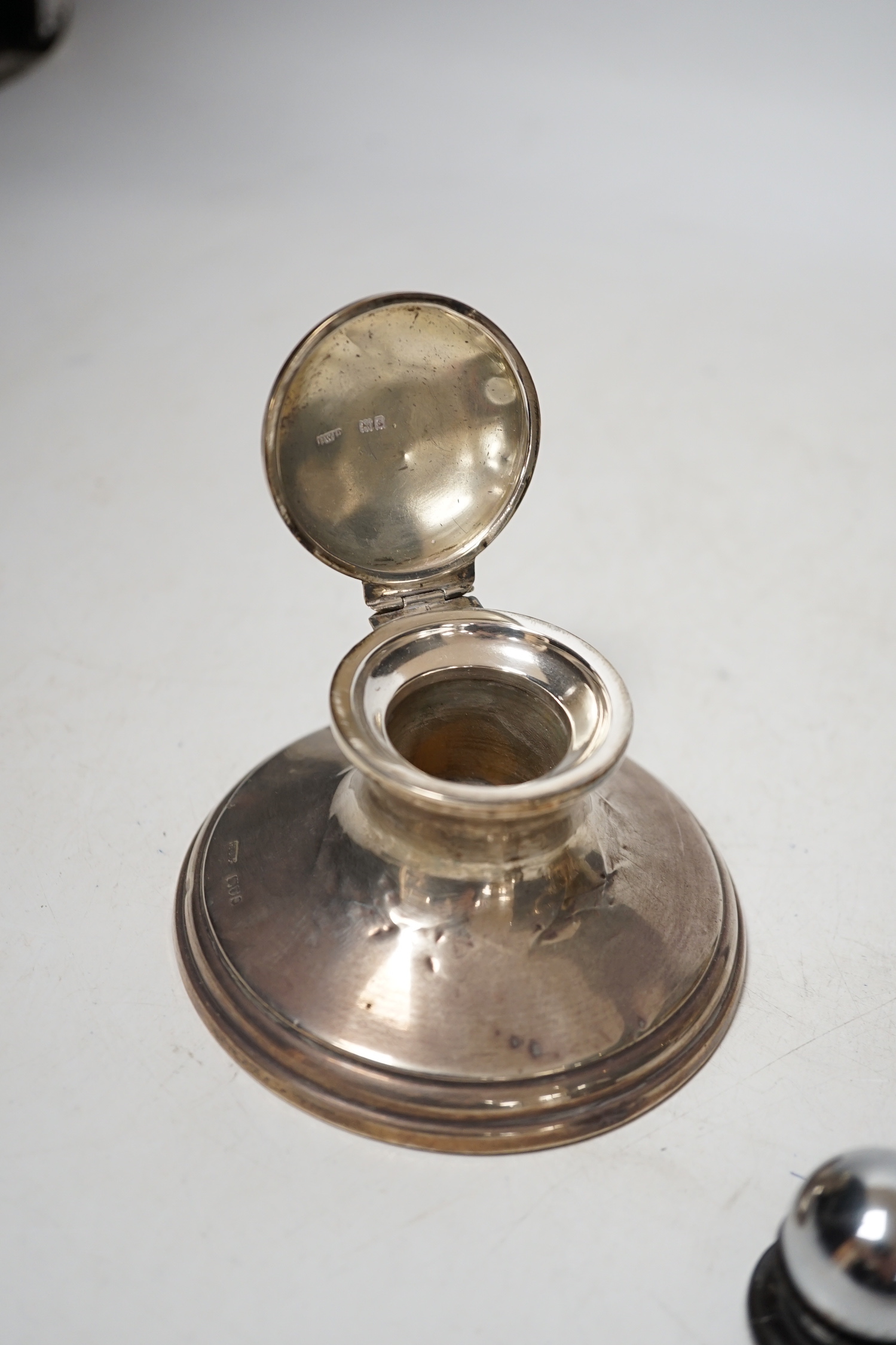 A 1930's silver sauceboat a silver mounted inkwell and one other item.